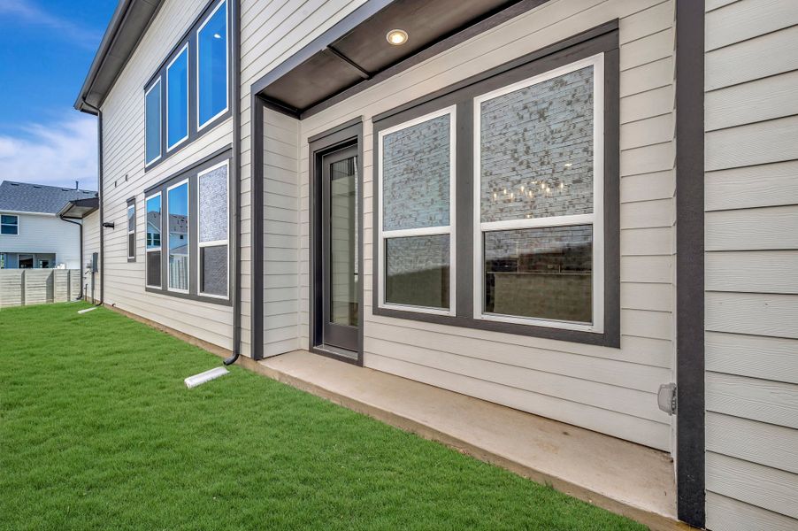 Exterior details and patio area of a home in The Retreat at Harvest, Argyle (Image 4).