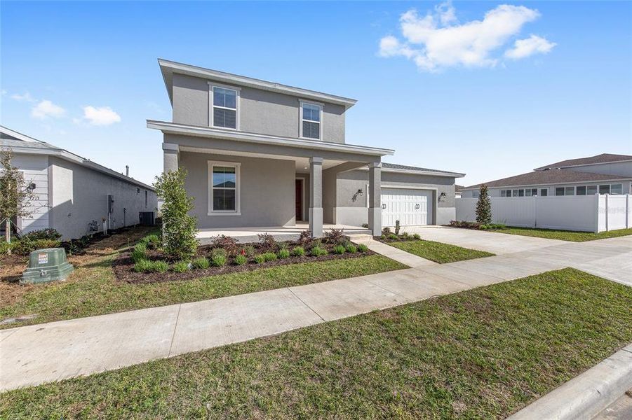 Front exterior of a new home in Calesa Township, Ocala, FL, highlighting curb appeal (Image 23).