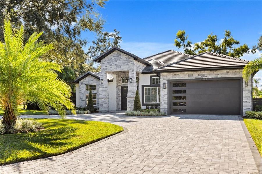 Front exterior of a new home in , Clermont, FL, highlighting curb appeal (Image 33). Front exterior of a new home in , Clermont, FL, highlighting curb appeal (Image 33).