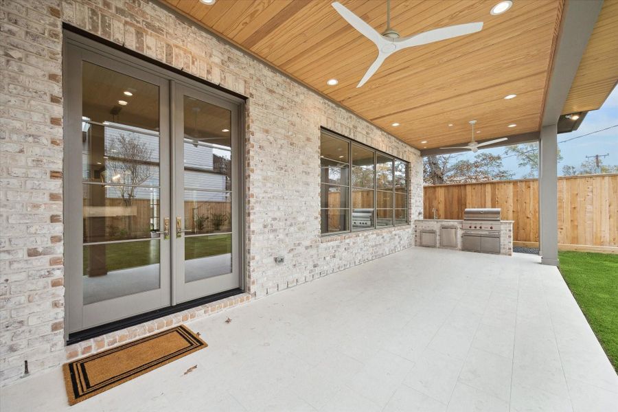 Spacious covered Veranda overlooking Big backyard. Room for a future pool and grass space! Patio will accommodate seating and outdoor dining! Summer kitchen with work sink and Wolf Grill! Spacious covered Veranda overlooking Big backyard. Room for a future pool and grass space! Patio will accommodate seating and outdoor dining! Summer kitchen with work sink and Wolf Grill!