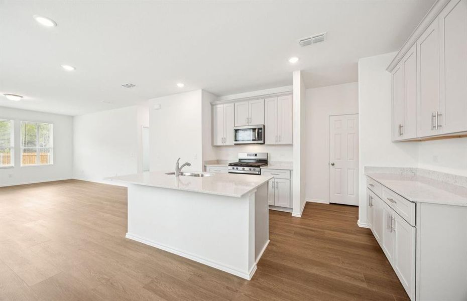 Kitchen featuring a large island ideal for informal dining and gatherings Kitchen featuring a large island ideal for informal dining and gatherings