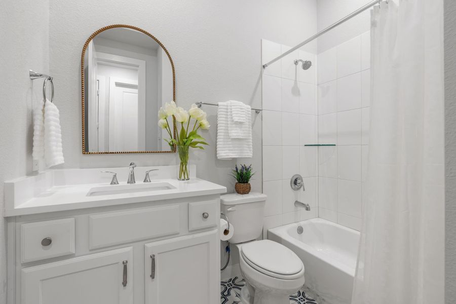 Beautiful full bath down - supports the flex room and guests - updated floor tile enhances the room