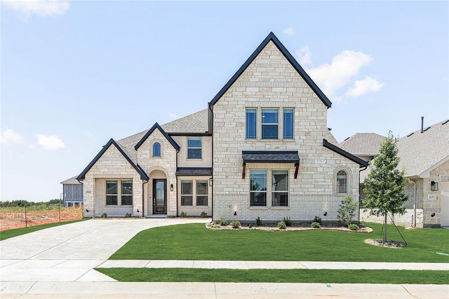 Front exterior of a new home in Chaparral Park, Oak Point, TX, highlighting curb appeal (Image 21). Front exterior of a new home in Chaparral Park, Oak Point, TX, highlighting curb appeal (Image 21).