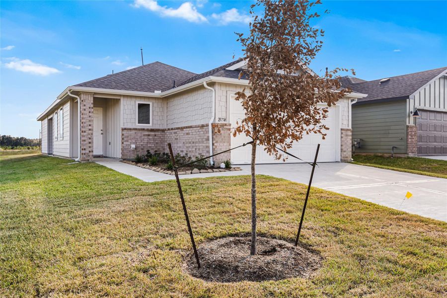 Front exterior of a new home in Hill & Dale Ranch, Splendora, TX, highlighting curb appeal (Image 18).