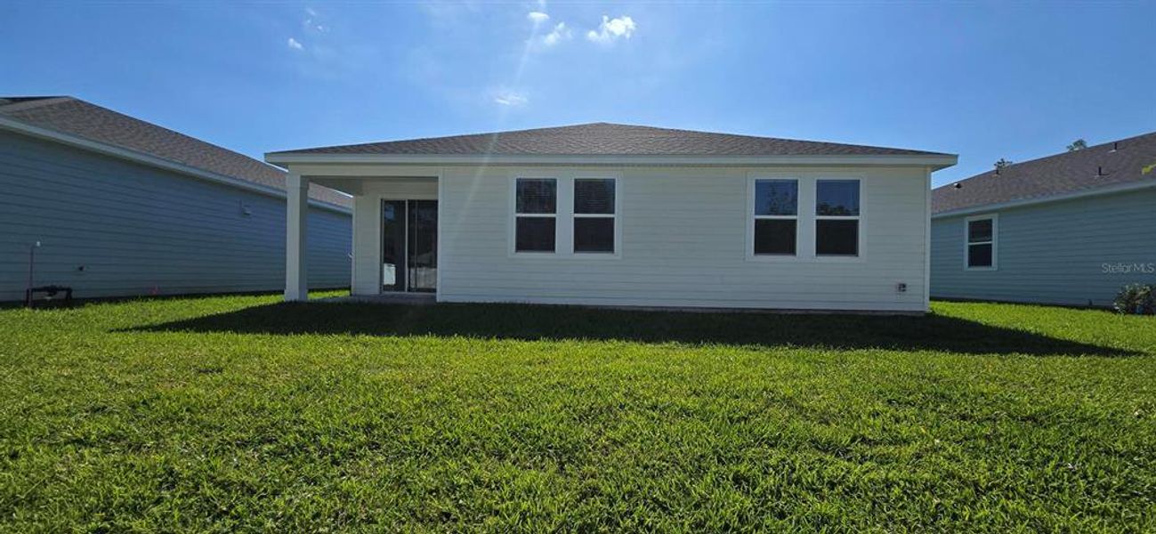 Exterior details and patio area of a home in , Palm Coast (Image 2). Exterior details and patio area of a home in , Palm Coast (Image 2).