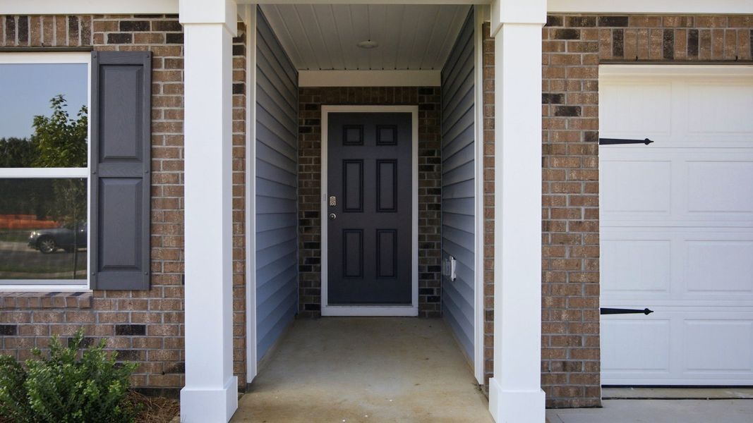 Exterior details and patio area of a home in Bynum Farms, Farmville (Image 3). Exterior details and patio area of a home in Bynum Farms, Farmville (Image 3).