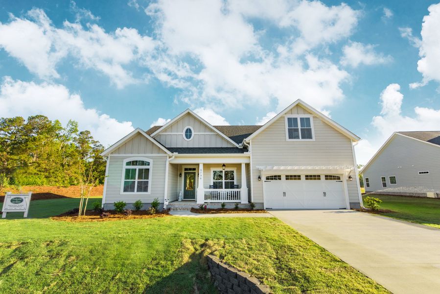 Representative exterior photo of a completed home built from the Helmsley by Bill Clark Homes in The Sanctuary at Sunset Beach, Sunset Beach, NC (Image 24). Representative exterior photo of a completed home built from the Helmsley by Bill Clark Homes in The Sanctuary at Sunset Beach, Sunset Beach, NC (Image 24).