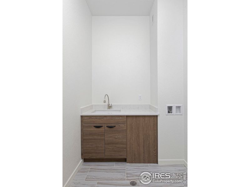 Laundry Room with base cabinet & sink