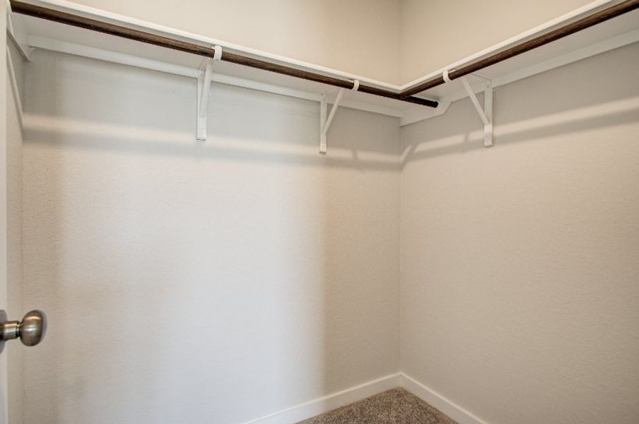 A white wall with a metal railing. A white wall with a metal railing.