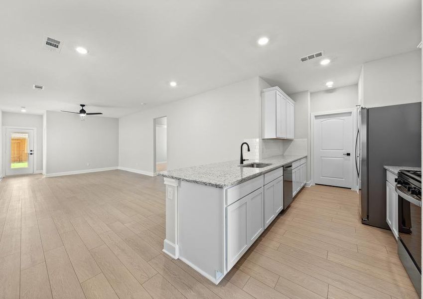 The family room of the Cedar sits right off of the kitchen. The family room of the Cedar sits right off of the kitchen.