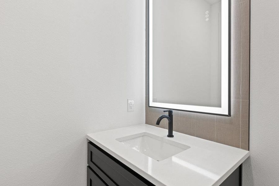 The guest powder room off the game room is perfect for when you are hosting events.