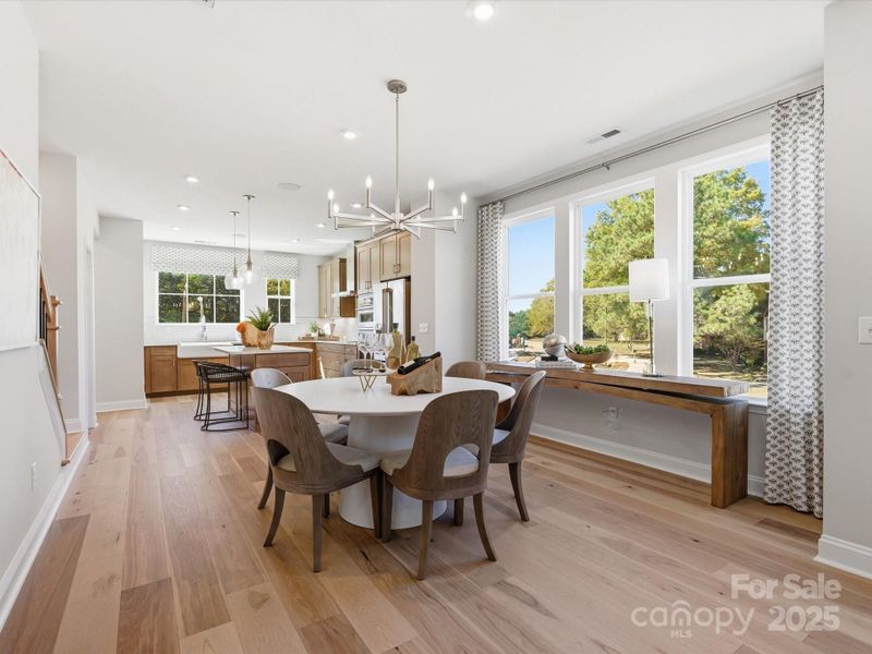 Dining Space Bridging Kitchen and Great Room. *Model Photos | Actual Finishes, Structural Selections, and Orientation May Vary.
