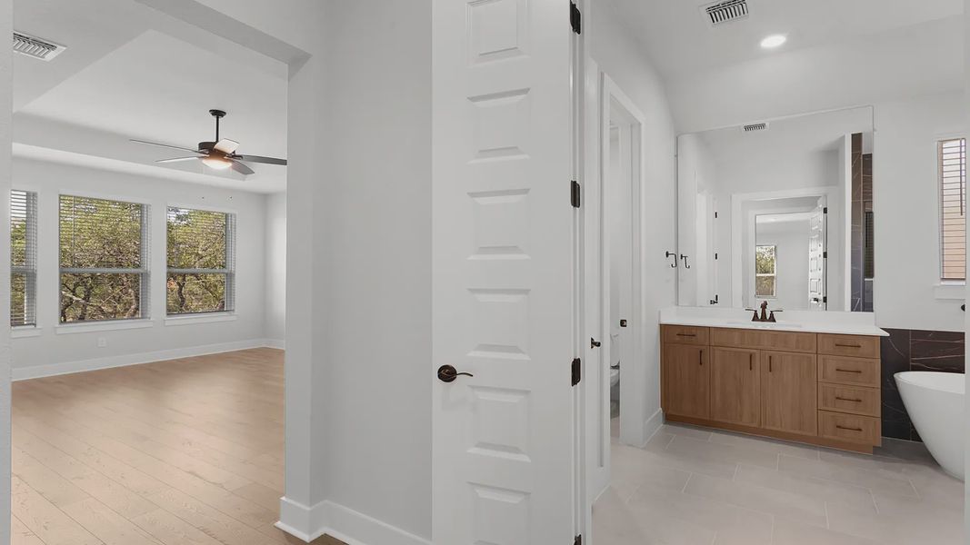 Representative furnished interior of a home built from the Mariah by Chesmar Homes in Newhaven, Manor (Image 7).