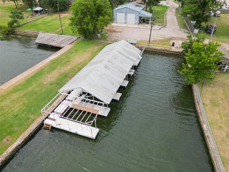 Dock area with a water view, AND WORKSHOP BOAT STORAGE GARAGE Dock area with a water view, AND WORKSHOP BOAT STORAGE GARAGE