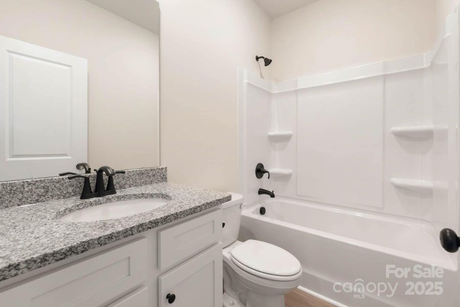 Furnished interior view inside a new home in Stagecoach Station, Gastonia (Image 6).