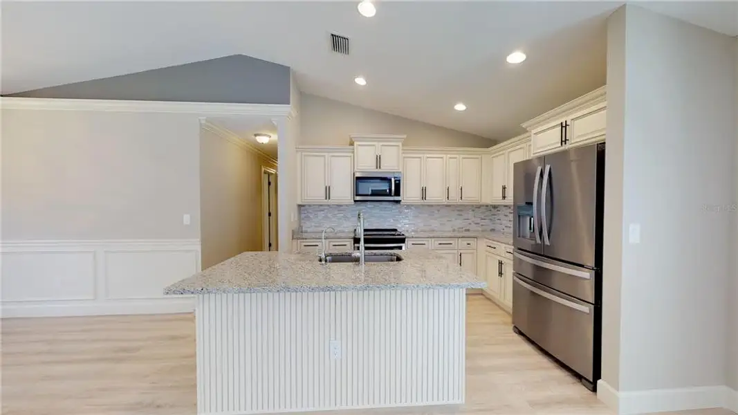 Furnished interior view inside a new home in , North Port (Image 12).