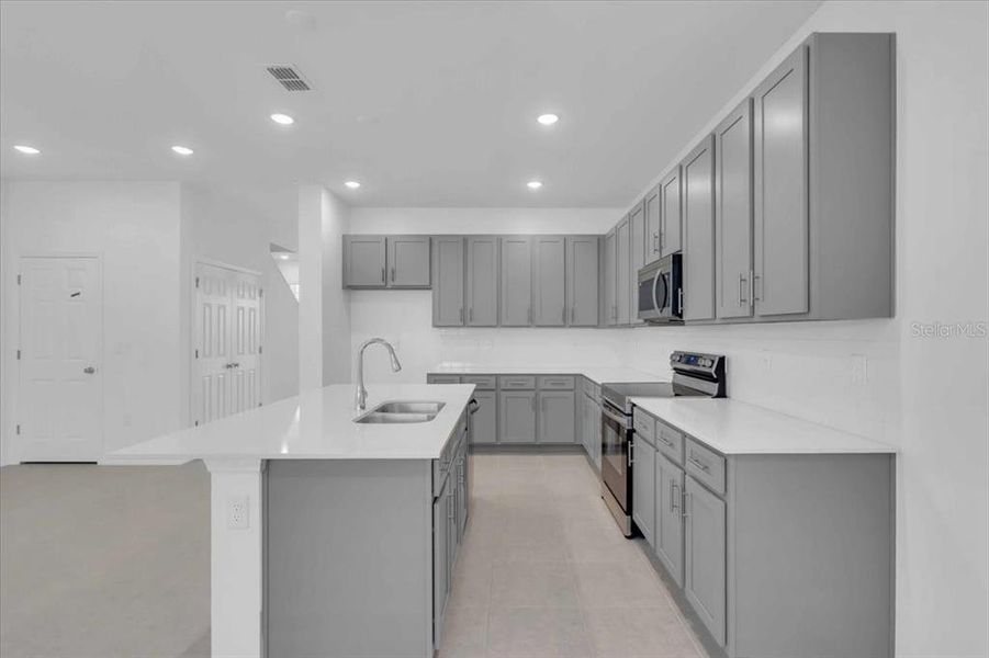 Furnished interior view inside a new home in The Residences at Emerson Park, Apopka (Image 8). Furnished interior view inside a new home in The Residences at Emerson Park, Apopka (Image 8).