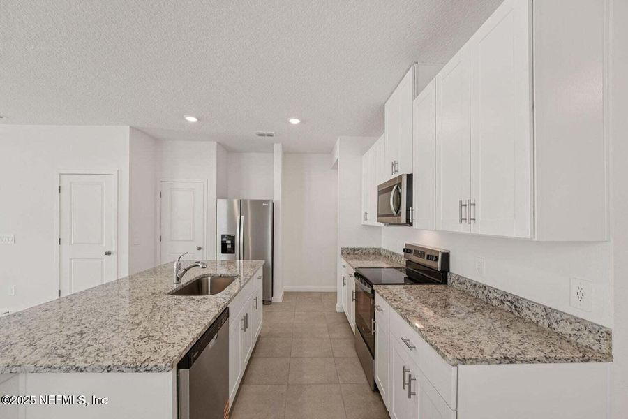 Furnished interior view inside a new home in Flagler Village - Classic Series, Palm Coast (Image 10). Furnished interior view inside a new home in Flagler Village - Classic Series, Palm Coast (Image 10).