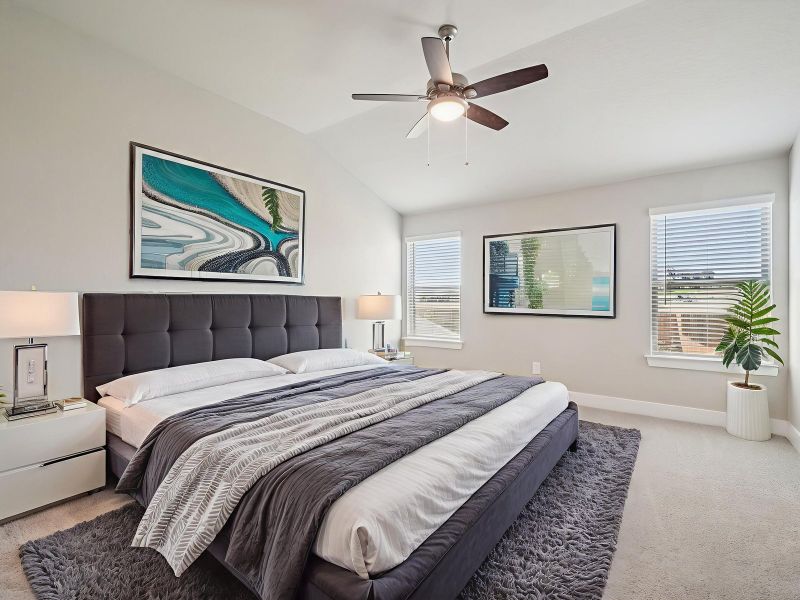 Virtually staged primary suite in the Red River floorplan at a Meritage Homes community.