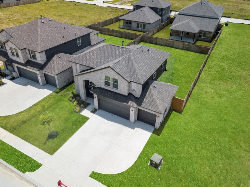 Aerial view highlighting the home’s prime location within the neighborhood and its impressive curb appeal. The Lavaca floor plan built by CastleRock Communities! Amazing new home on a large lot for all your furry friends or that pool you always wanted. Enegy Star Rated to save you money! Aerial view highlighting the home’s prime location within the neighborhood and its impressive curb appeal. The Lavaca floor plan built by CastleRock Communities! Amazing new home on a large lot for all your furry friends or that pool you always wanted. Enegy Star Rated to save you money!