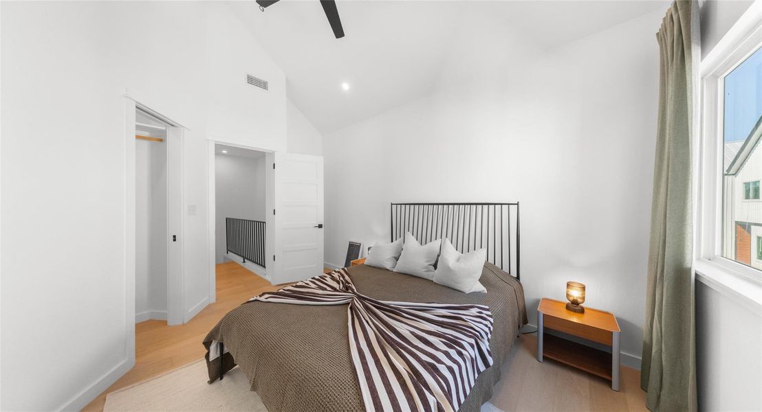 A peaceful secondary bedroom filled with natural light — a comfortable space for guests, a home office, or quiet downtime. Model No. 105 Shown.