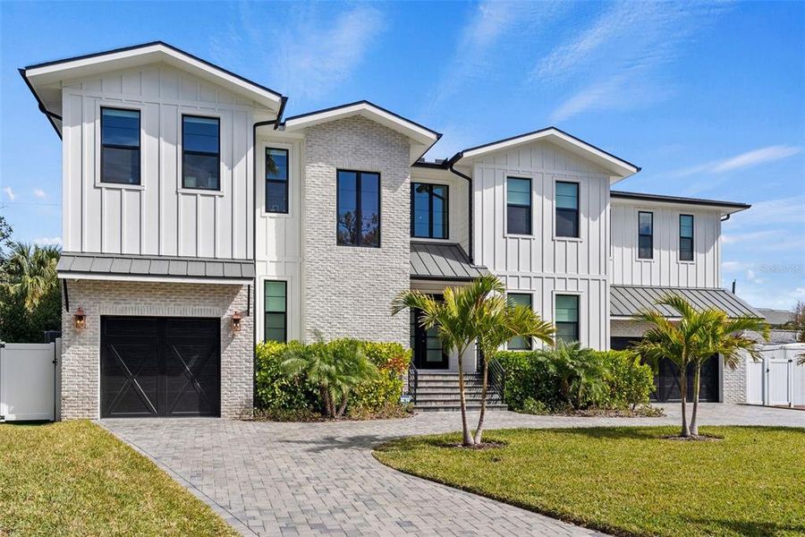Front exterior of a new home in , Tampa, FL, highlighting curb appeal (Image 27).