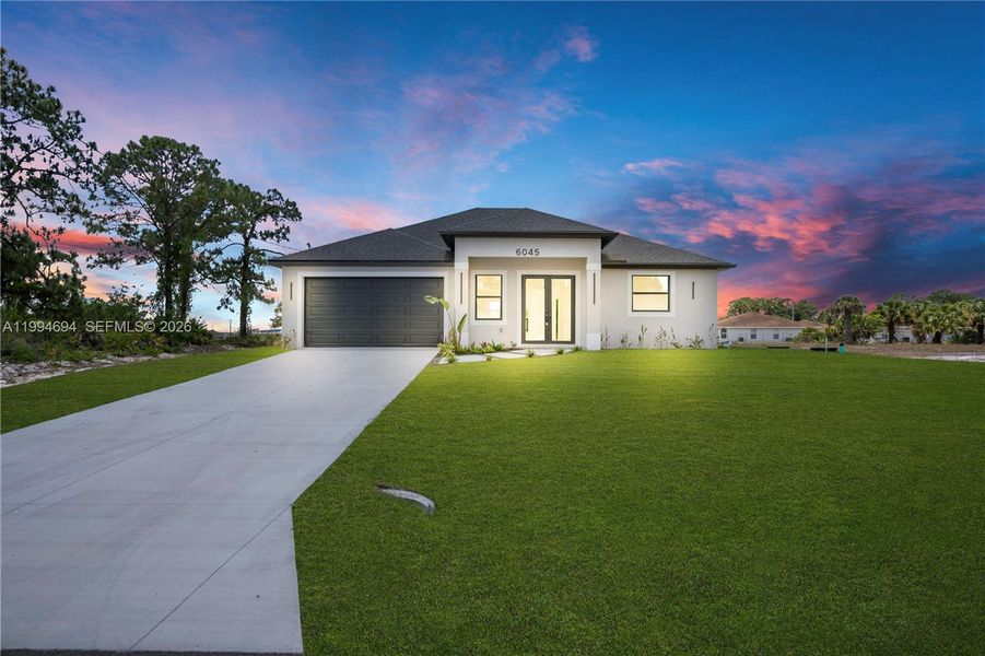 Front exterior of a new home in , Labelle, FL, highlighting curb appeal (Image 2). Front exterior of a new home in , Labelle, FL, highlighting curb appeal (Image 2).