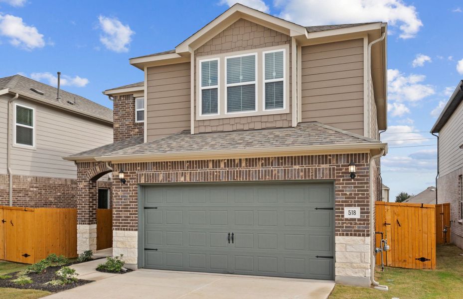 Front exterior of a new home in Crosswinds, Kyle, TX, highlighting curb appeal (Image 5). Front exterior of a new home in Crosswinds, Kyle, TX, highlighting curb appeal (Image 5).