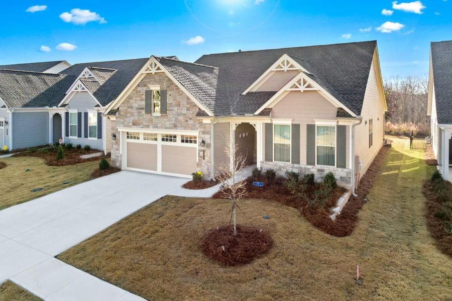 Front exterior of a new home in , Hoschton, GA, highlighting curb appeal (Image 25).