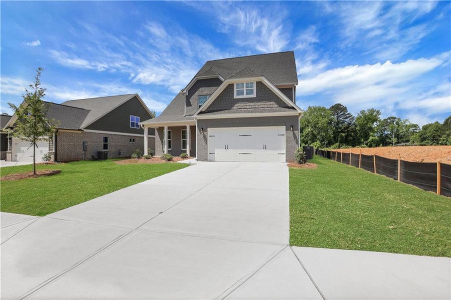 Front exterior of a new home in , Loganville, GA, highlighting curb appeal (Image 25). Front exterior of a new home in , Loganville, GA, highlighting curb appeal (Image 25).