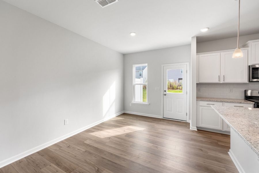 Spacious, unfurnished interior of a new home in Poets Walk, Whitsett (Image 15).