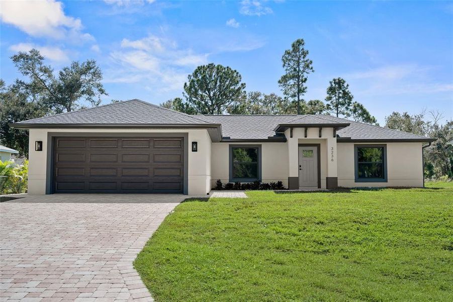 Front exterior of a new home in , North Port, FL, highlighting curb appeal (Image 2).