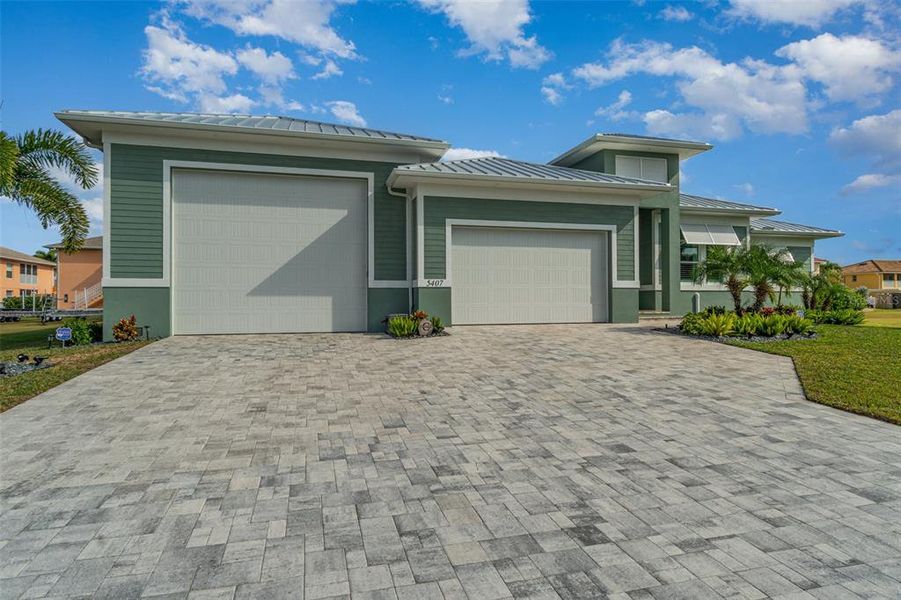 Front exterior of a new home in , Cape Coral, FL, highlighting curb appeal (Image 27).