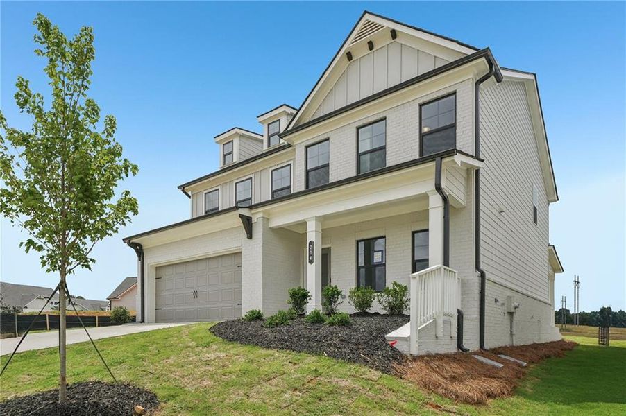 Front exterior of a new home in Fowler Farms, Auburn, GA, highlighting curb appeal (Image 2). Front exterior of a new home in Fowler Farms, Auburn, GA, highlighting curb appeal (Image 2).