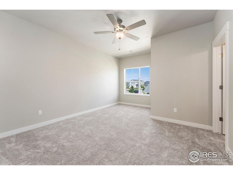 Second bedroom with ceiling fan included