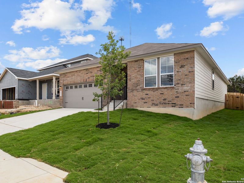 Front exterior of a new home in Royal Crest, San Antonio, TX, highlighting curb appeal (Image 2).