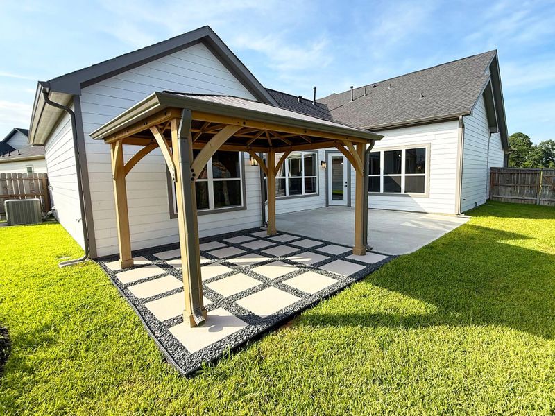 The Portico's courtyard serves as a private outdoor oasis, perfect for relaxing, entertaining, or enjoying serene moments surrounded by nature.  *Image depicts home as is with some elements virtually staged.*Image depicts home as is with some elements virtually staged.
