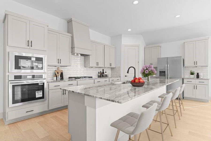 Kitchen adorned with white cabinets seamlessly integrated into an open dining area layout. Kitchen adorned with white cabinets seamlessly integrated into an open dining area layout.