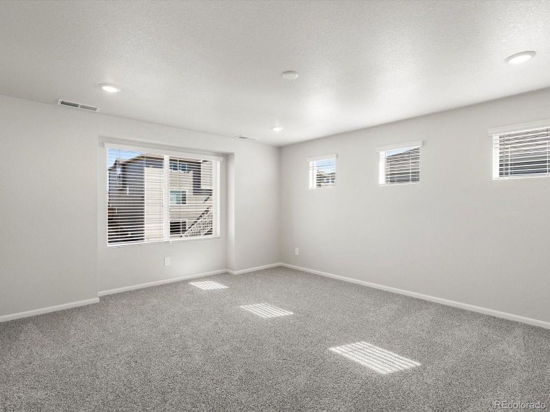 Spacious, unfurnished interior of a new home in Buffalo Highlands: The Flora Collection, Commerce City (Image 22).