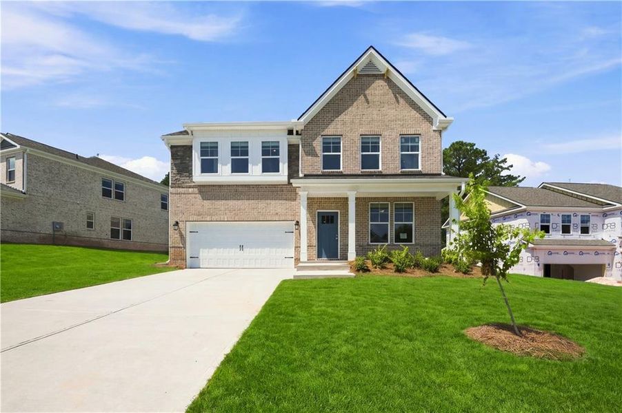 Front exterior of a new home in Burchwood, Stockbridge, GA, highlighting curb appeal (Image 2). Front exterior of a new home in Burchwood, Stockbridge, GA, highlighting curb appeal (Image 2).