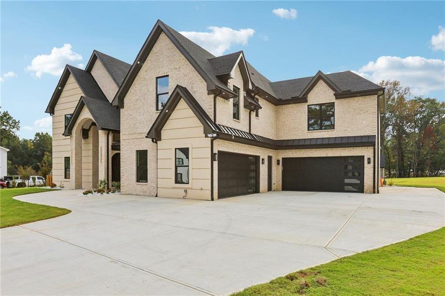 Front exterior of a new home in , Lawrenceville, GA, highlighting curb appeal (Image 1).