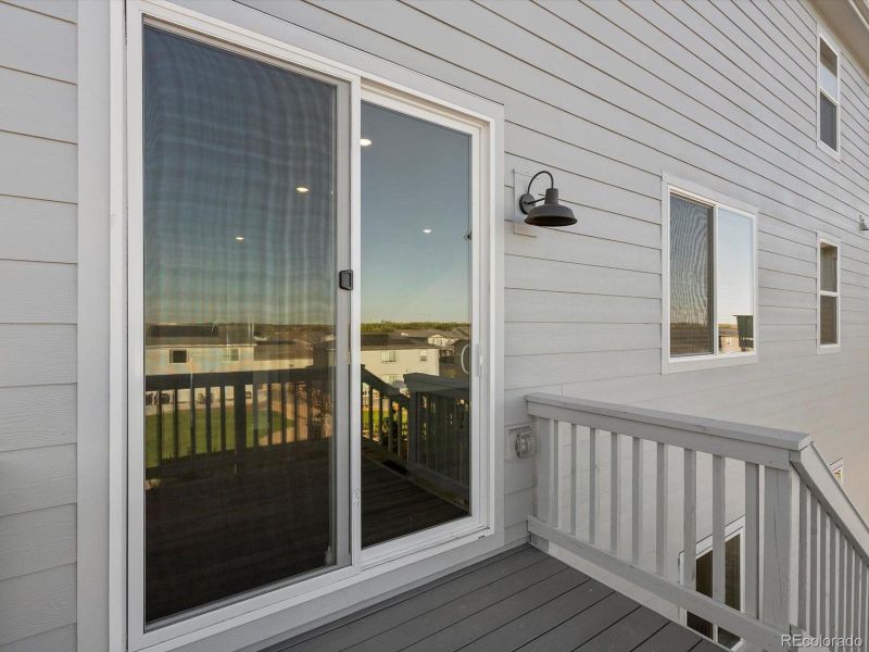 Exterior details and patio area of a home in Poudre Heights: The Lakes Collection, Windsor (Image 3).