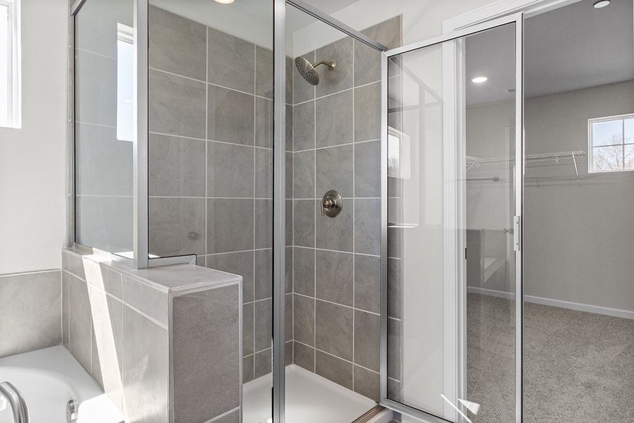 A bathroom with a glass shower. A bathroom with a glass shower.