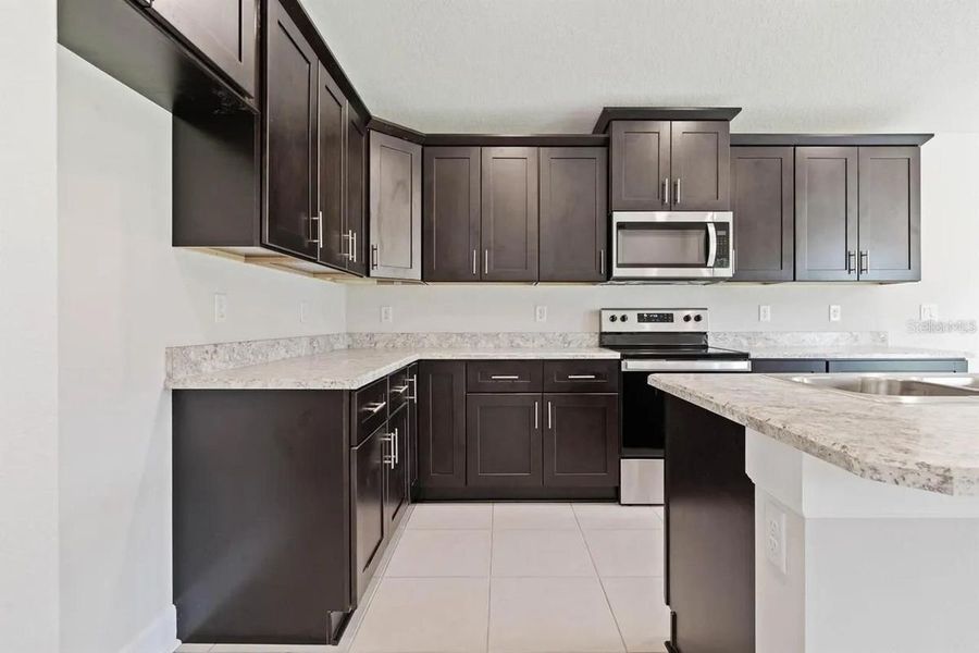 Representative furnished interior of a home built from the 1512 by Adams Homes in Winding Oaks, Weeki Wachee (Image 6).