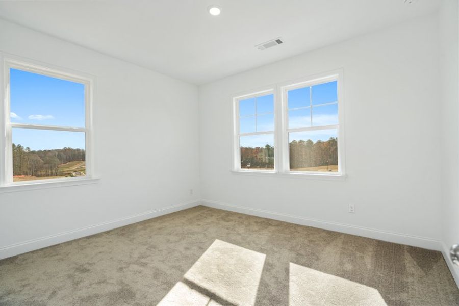 Representative unfurnished interior of a home built from the Ingram by Taylor Morrison in Falls Creek, Flowery Branch (Image 38).