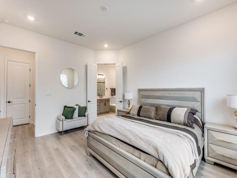 The primary suite featuers natural light and its own ensuite.