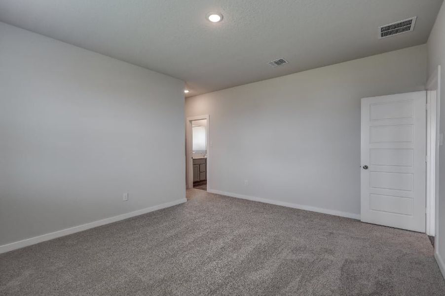 A hallway with white doors. A hallway with white doors.