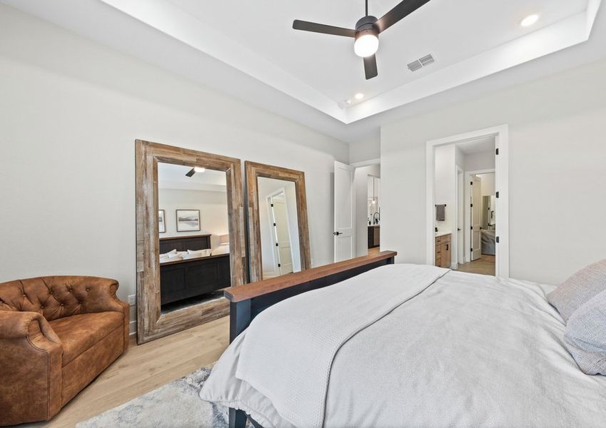 The master suite has a large bedroom, ensuite bathroom and walk-in closet.