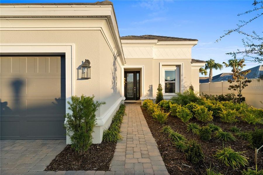 Exterior details and patio area of a home in Esplanade at Wiregrass Ranch, Wesley Chapel (Image 28).