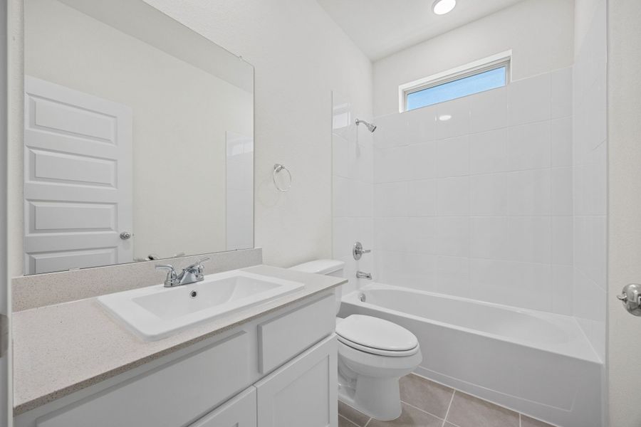 Bathroom in the Elm home plan by Trophy Signature Homes – REPRESENTATIVE PHOTO
